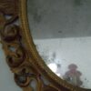Cornice specchio ovale a cartoccio dorato